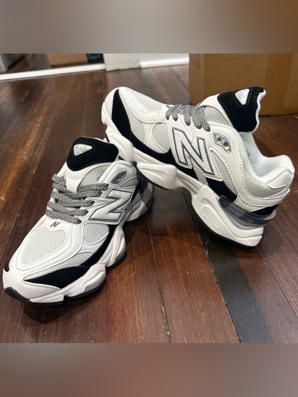 New Balance White and Black Runner Sneakers